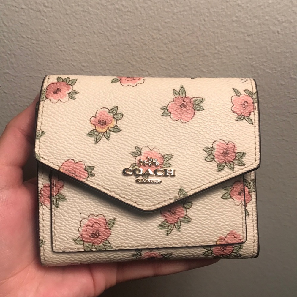 Real and brand new floral coach leather wallet.